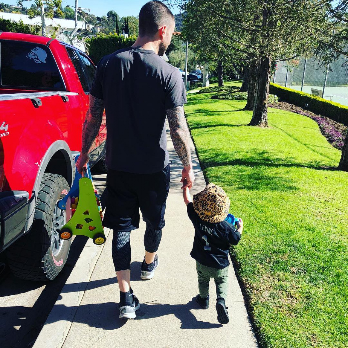 Adam Levine and his daughter Dusty Rose take a stroll in new photo